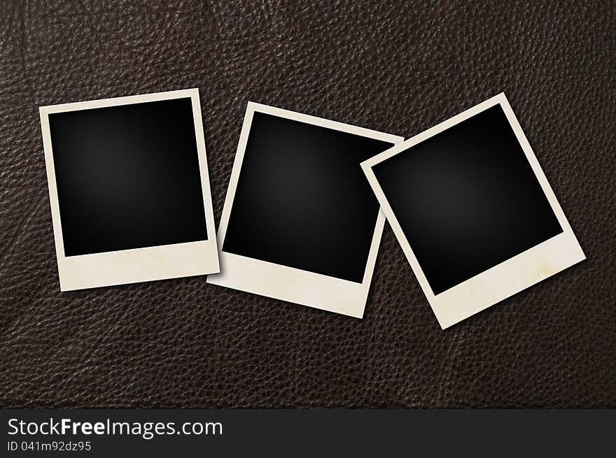 Instant films on brown leather background. Instant films on brown leather background