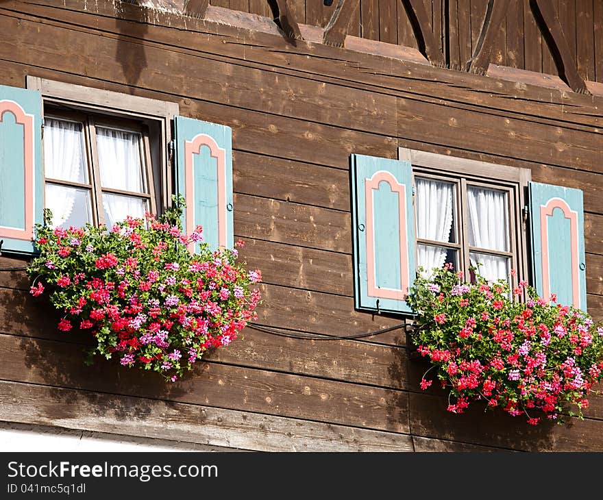 Old house with flowers on the window