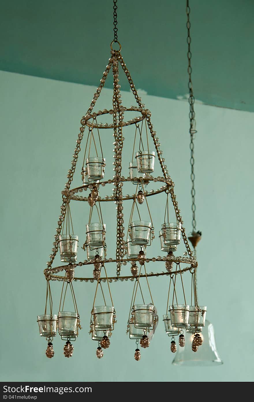 Candles Chandelier in vintage retro style hanged in a mansion house. Candles Chandelier in vintage retro style hanged in a mansion house