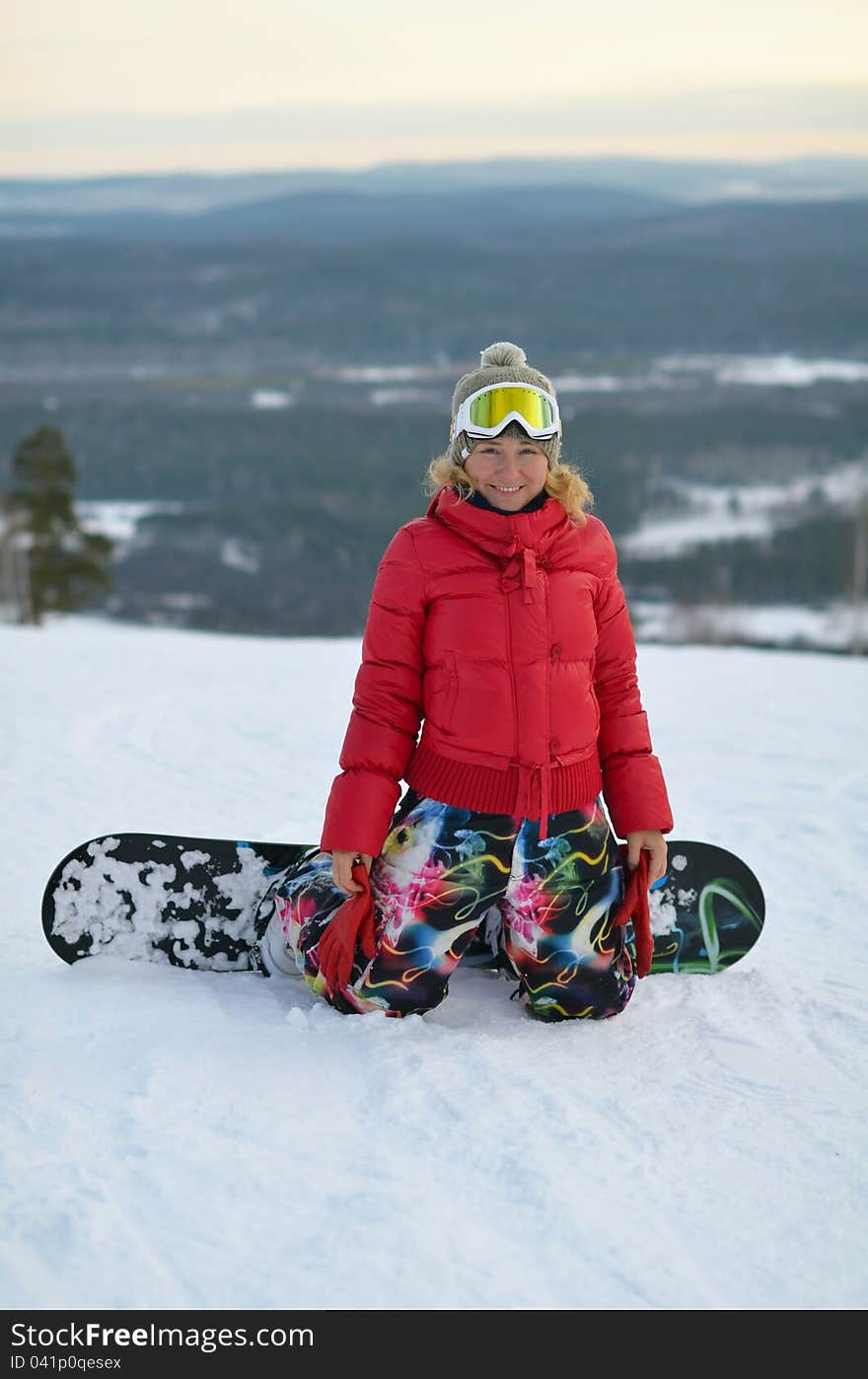 Portrait of smiling girl on snowboard. Portrait of smiling girl on snowboard