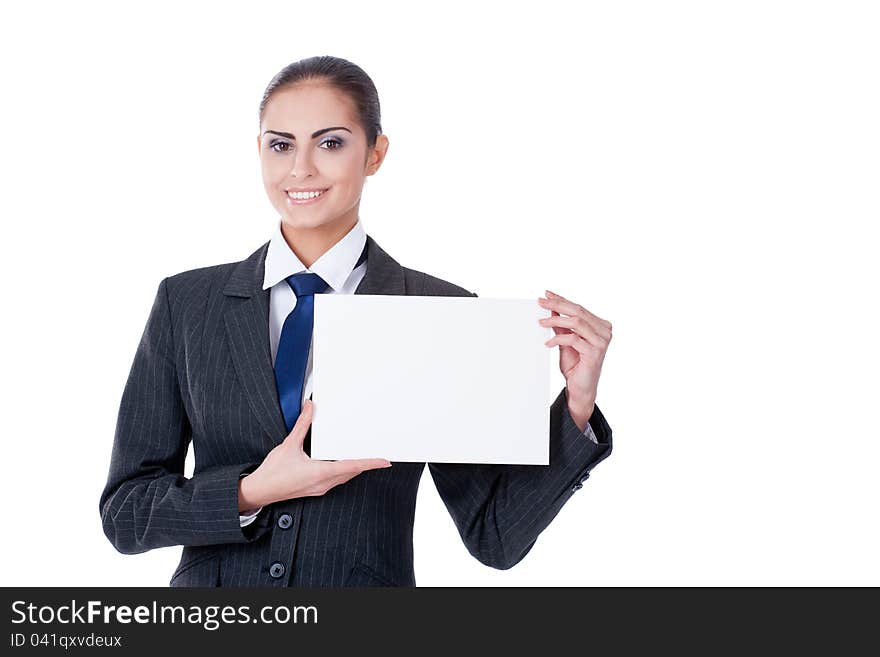 Young businesswoman pointing into empty blank and smiling