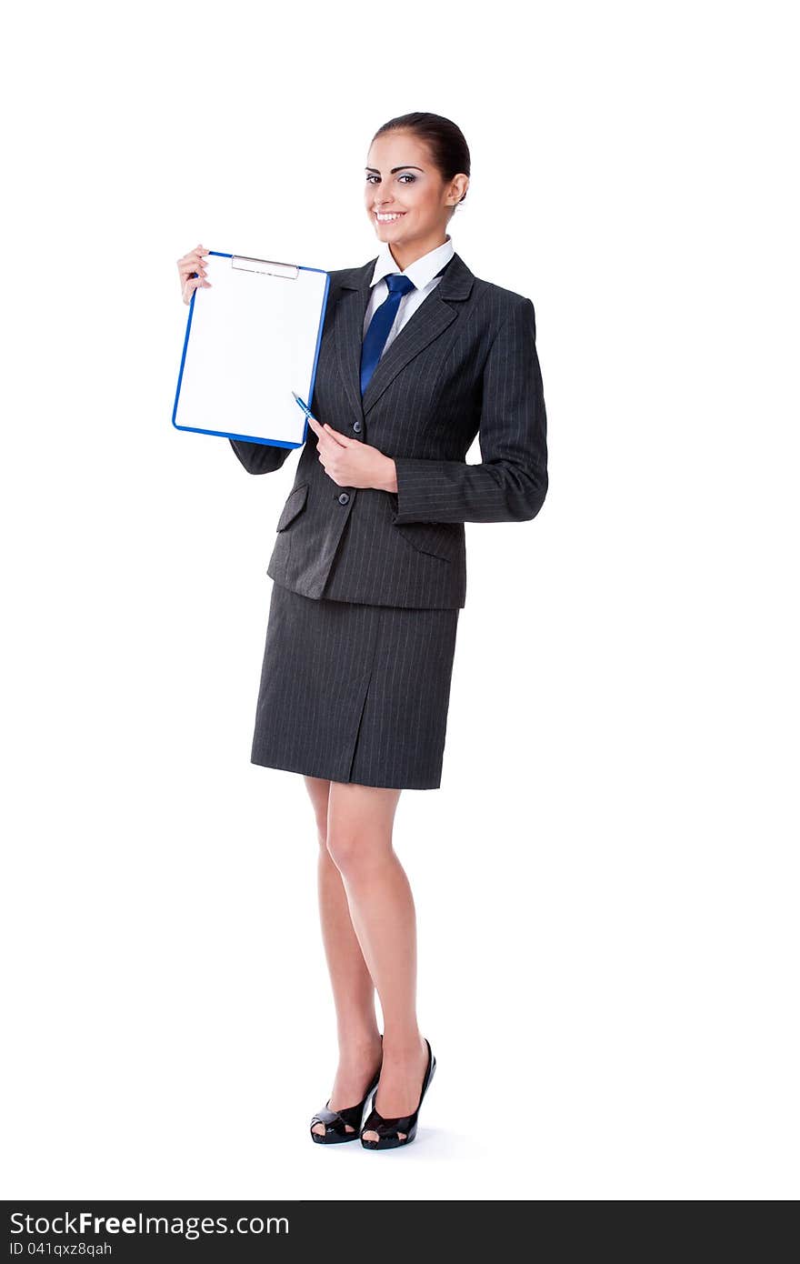 Young businesswoman pointing by pen into empty blank. Young businesswoman pointing by pen into empty blank