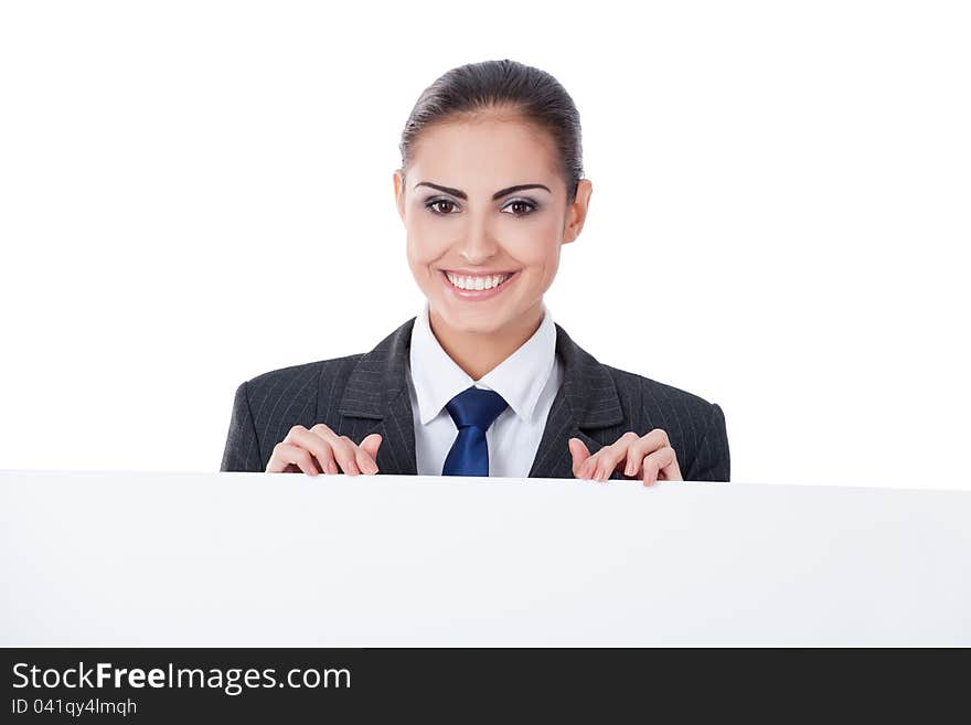 Young businesswoman pointing on copyspace on white background