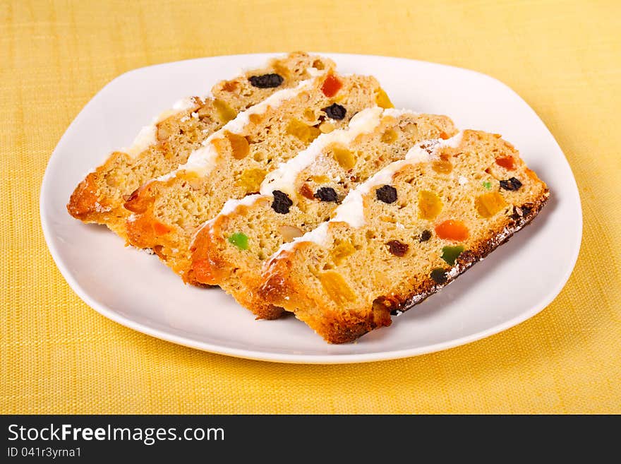 German traditional Christmas cakes on yellow tablecloth. German traditional Christmas cakes on yellow tablecloth