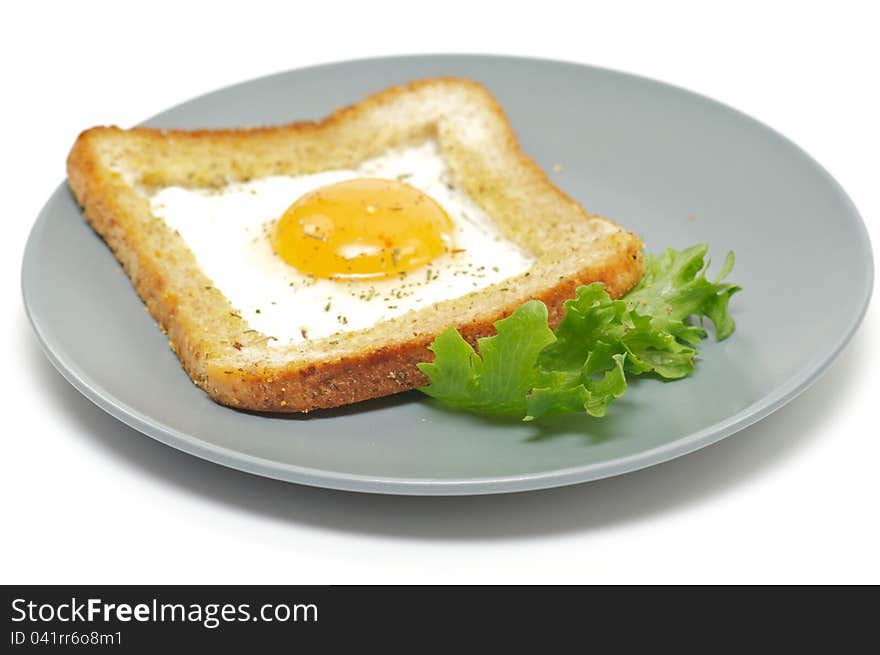 Fried eggs in French with crackling bread and spices