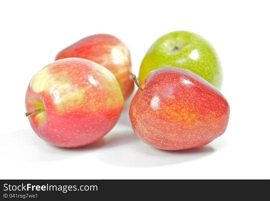 Four delicious apples on white background