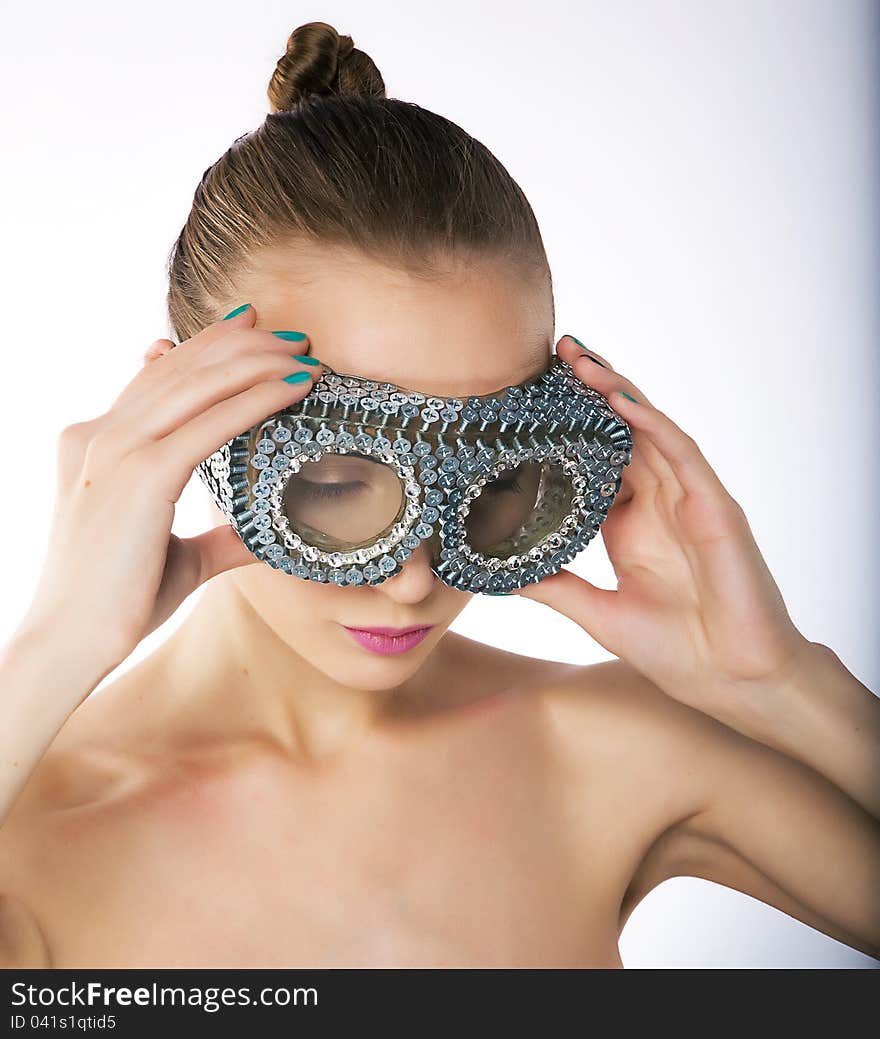 Wellness - female in metallic silver binoculars