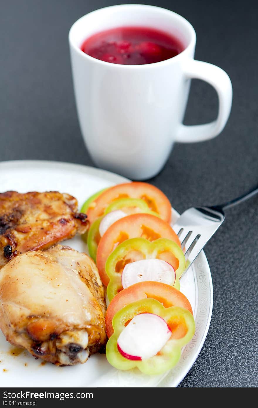 Fried Chicken Pieces And Vegetables