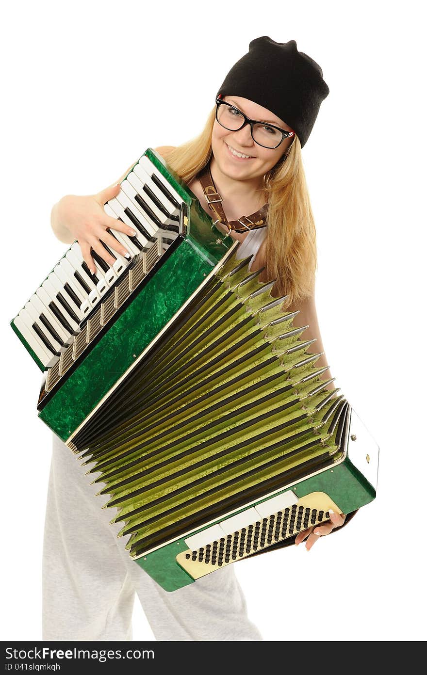 Portrait of the girl, playing an accordion in a cap and glasses. Portrait of the girl, playing an accordion in a cap and glasses