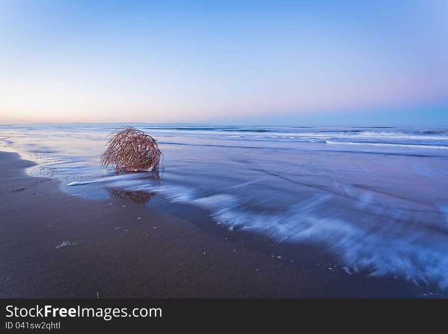 Long time to resume the movement of the sea and foam over sand. Long time to resume the movement of the sea and foam over sand