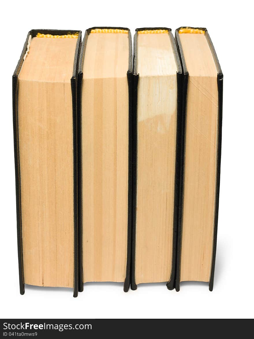 Stack of old black books on white background