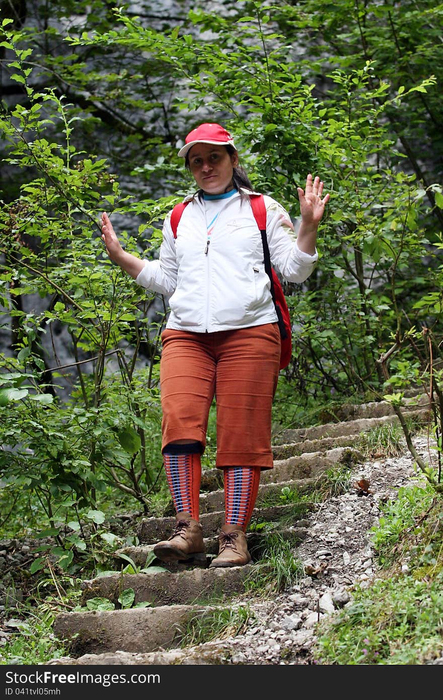 A tourist through the woods down stairs. A tourist through the woods down stairs