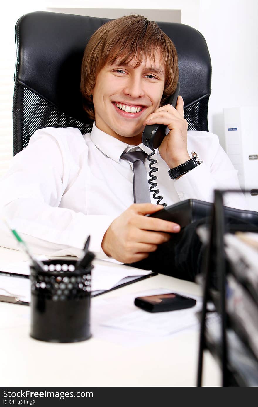 Young And Successful Businessman Talking By Phone