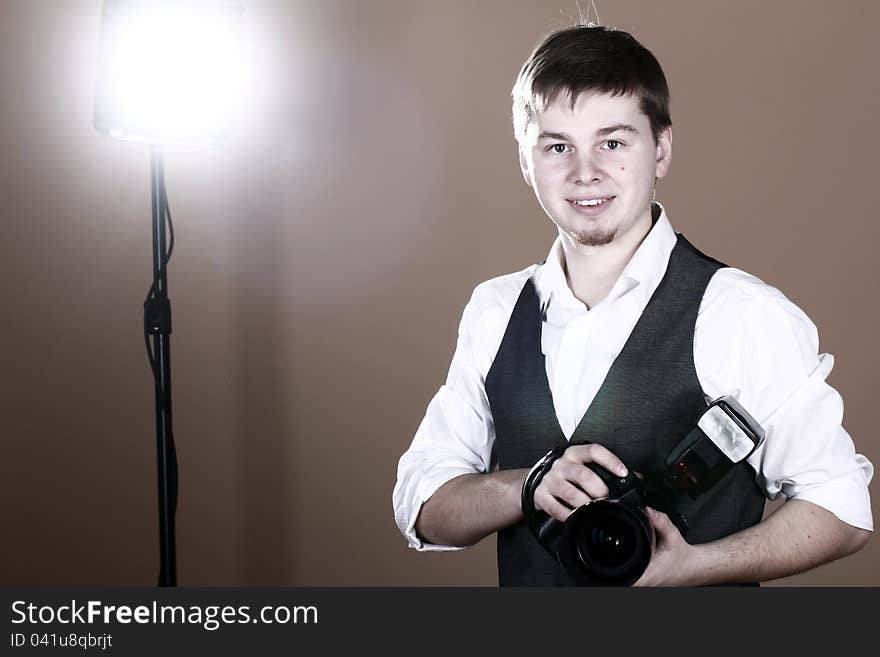 Photographer with camera in studio