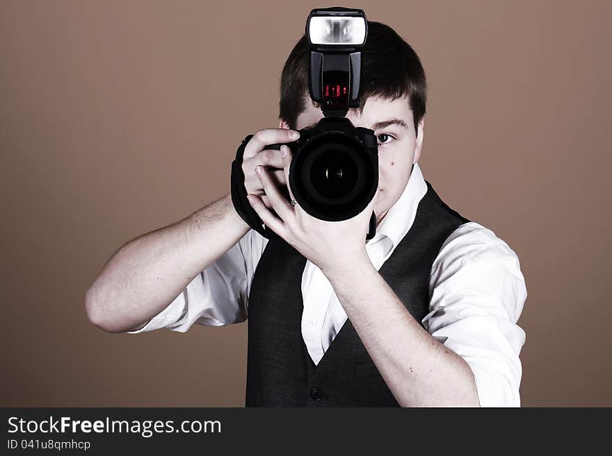 Photographer with camera in studio