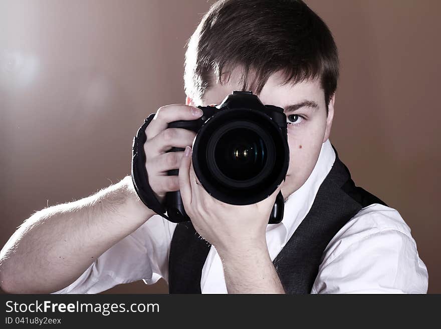 Photographer with camera in studio