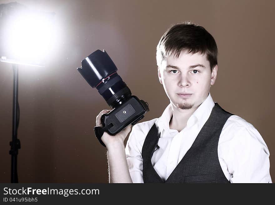 Photographer with camera in studio