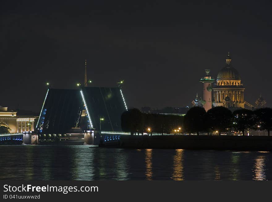 The raised palace bridge in St.-Petersburg at night