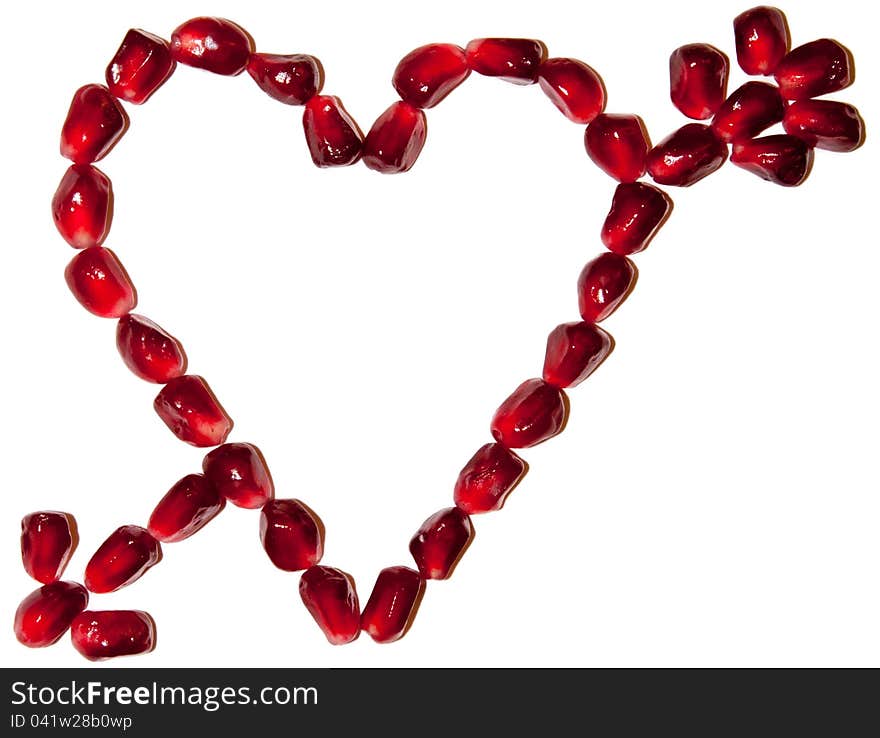 St. Valentine's symbol of love pierced by arrow made of pomegranate seeds. St. Valentine's symbol of love pierced by arrow made of pomegranate seeds