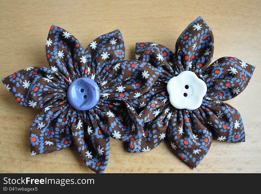 Colorful hand made brooches with buttons in the midlle. Colorful hand made brooches with buttons in the midlle.