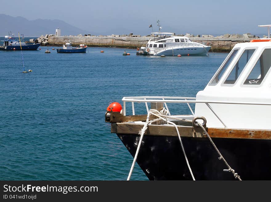 Boats and yacht moored in a harbour