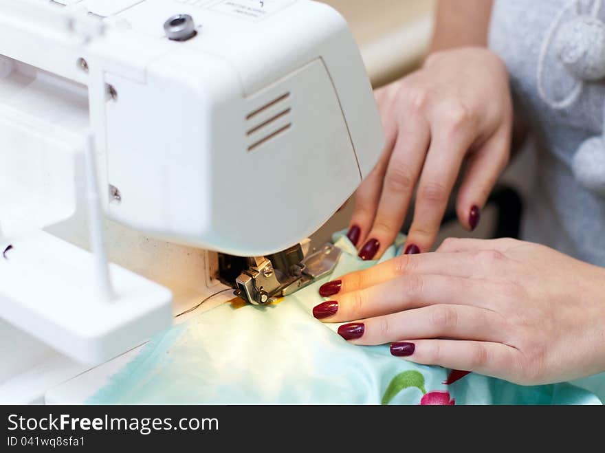 Female Hands Working On A Sewing Machine