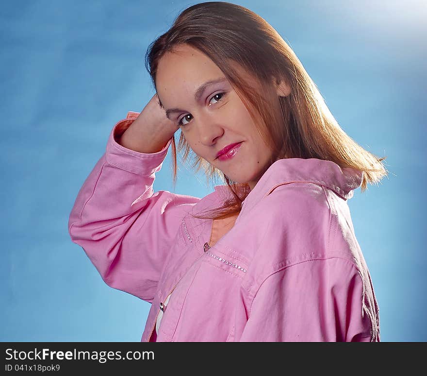 Pretty girl in pink posing pretty for the camera with humble look.