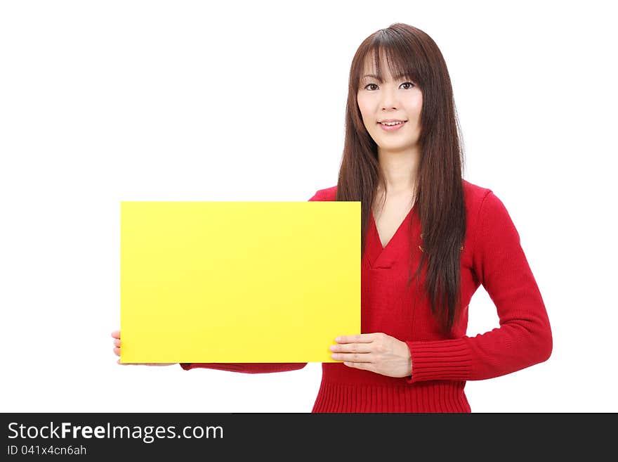 Young asian woman holding blank board