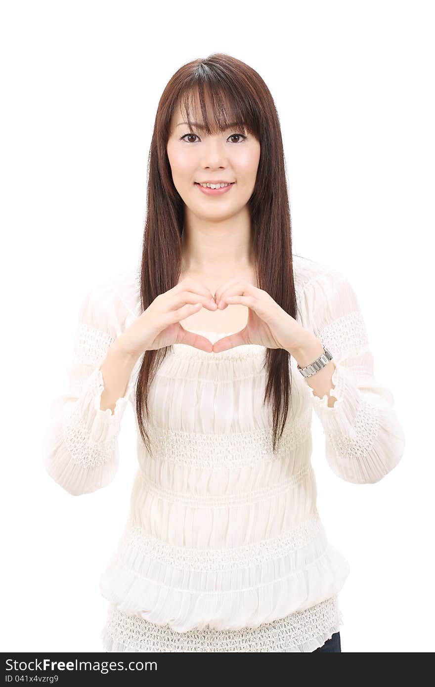 Young asian woman showing a heart with her fingers