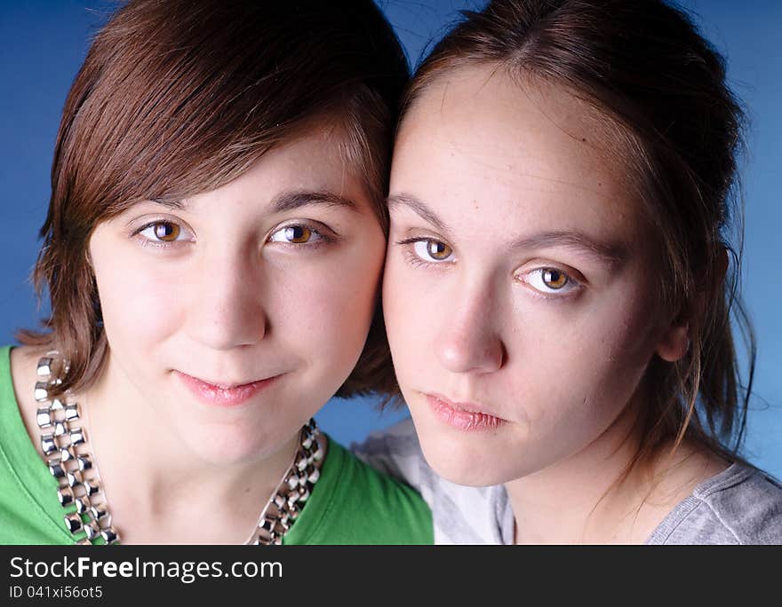 Girls posing for camera looking friendly. Girls posing for camera looking friendly