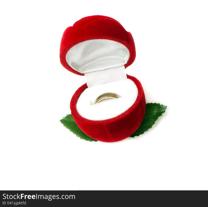 Red box for jeweller ornaments and a gold ring