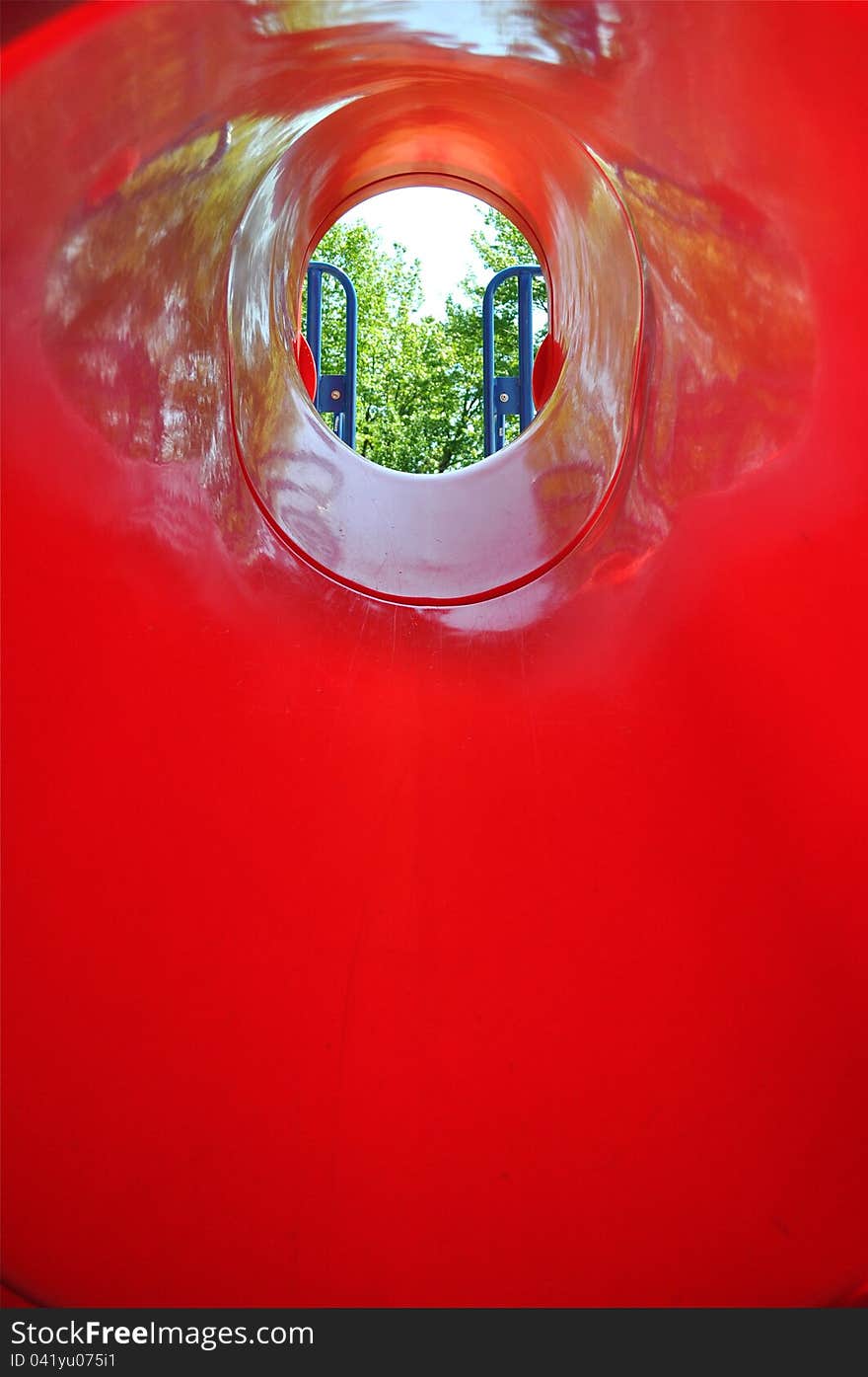 A hole of a huge slide in a playground. A hole of a huge slide in a playground