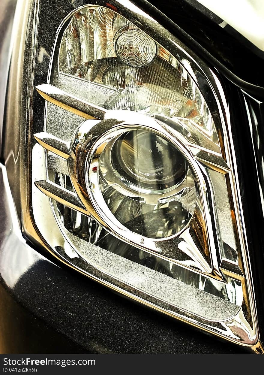 Closeup of car headlight - front view