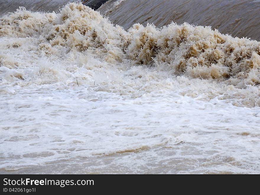 Dangerous rapids with brown water