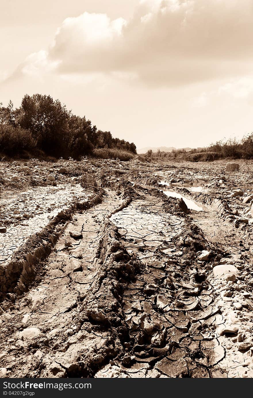 Dry river in summer under cloudy sky. Dry river in summer under cloudy sky