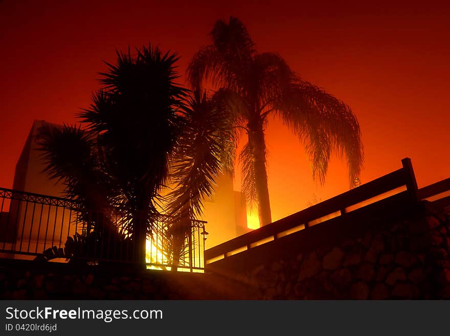 Foggy house at night with red light background beautiful pretty nice mood. Foggy house at night with red light background beautiful pretty nice mood