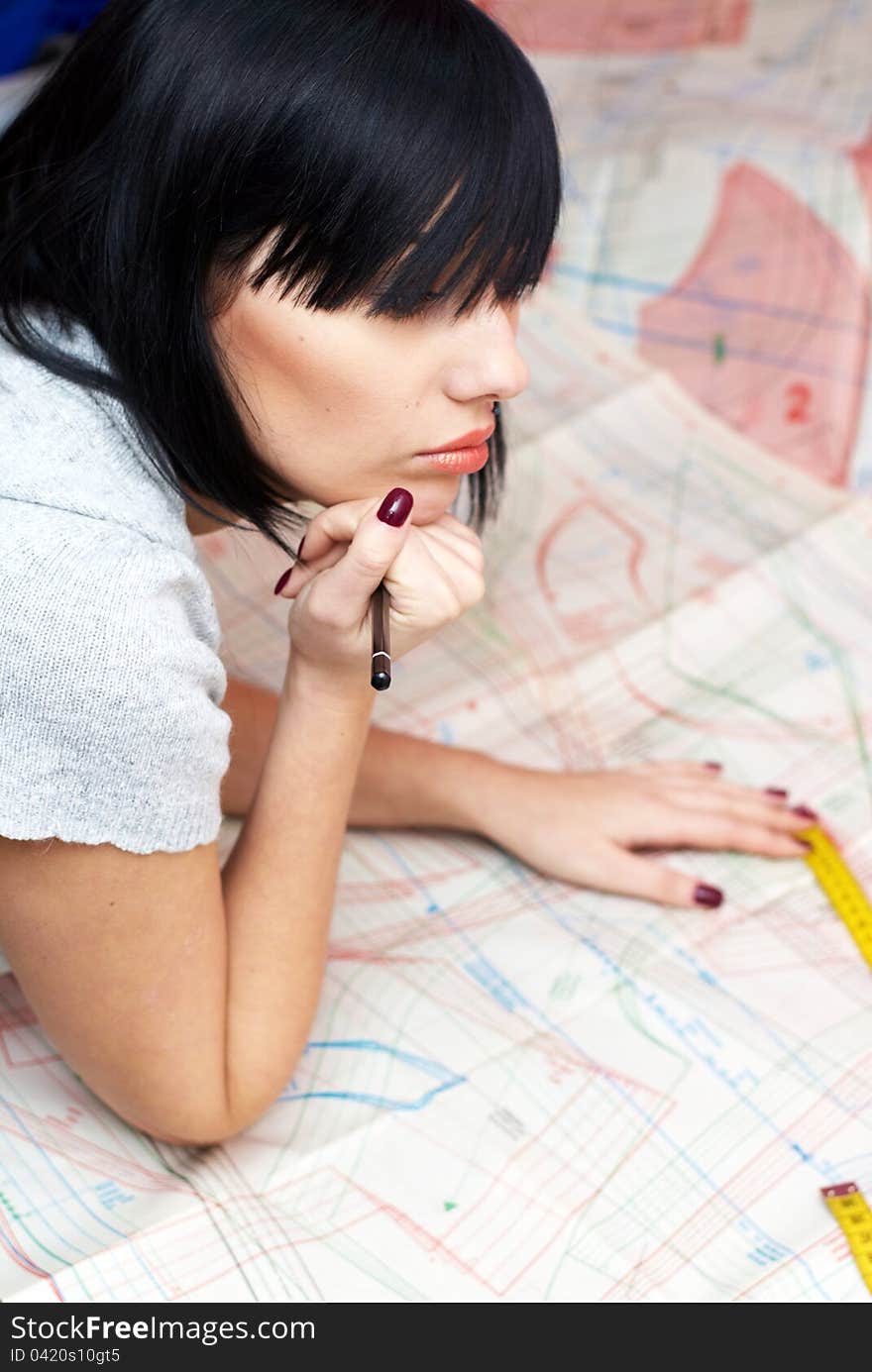 Young Seamstress Measuring Distance