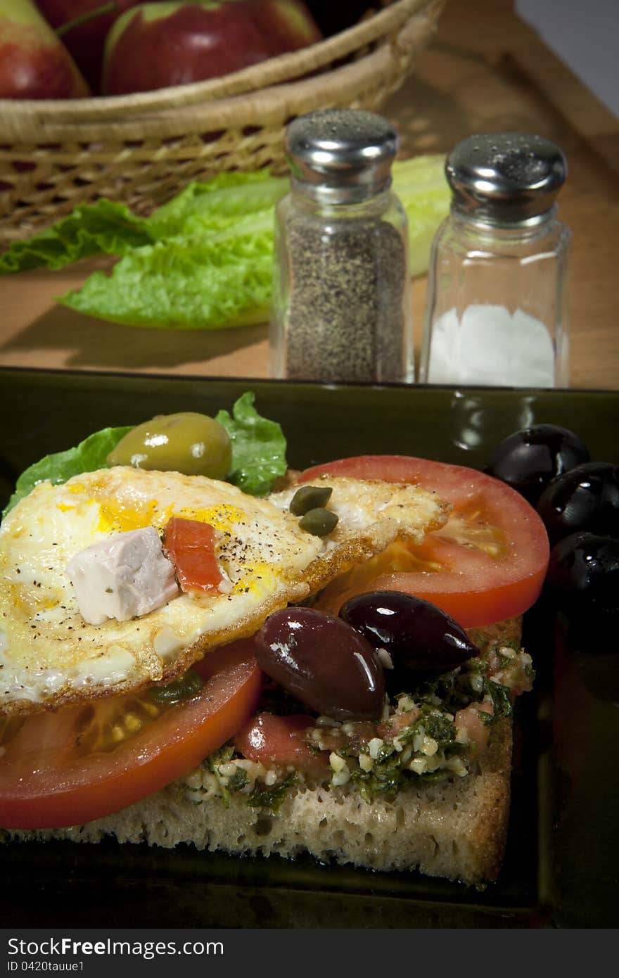 Very simple sandwich witch tomato, egg, olives and salad. Very simple sandwich witch tomato, egg, olives and salad.