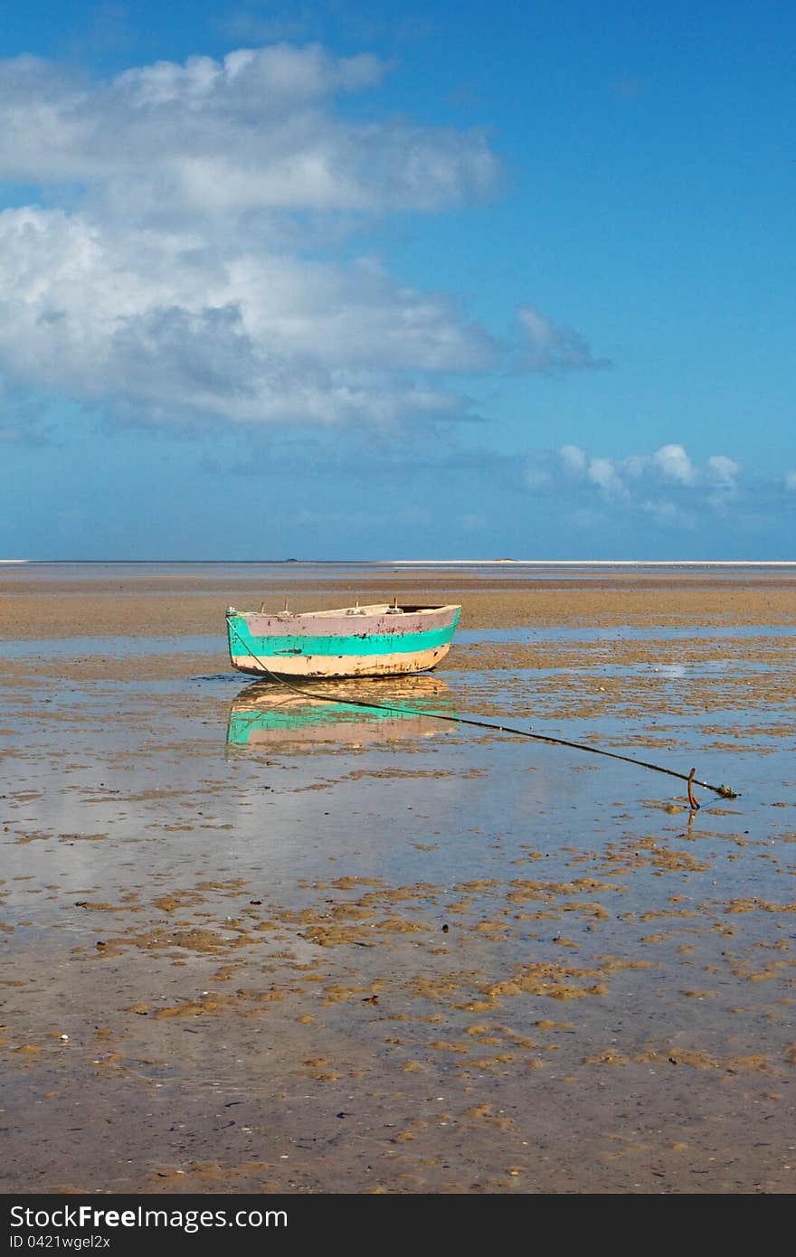 Tropical beach with old fishing boat and ocean. Tropical beach with old fishing boat and ocean