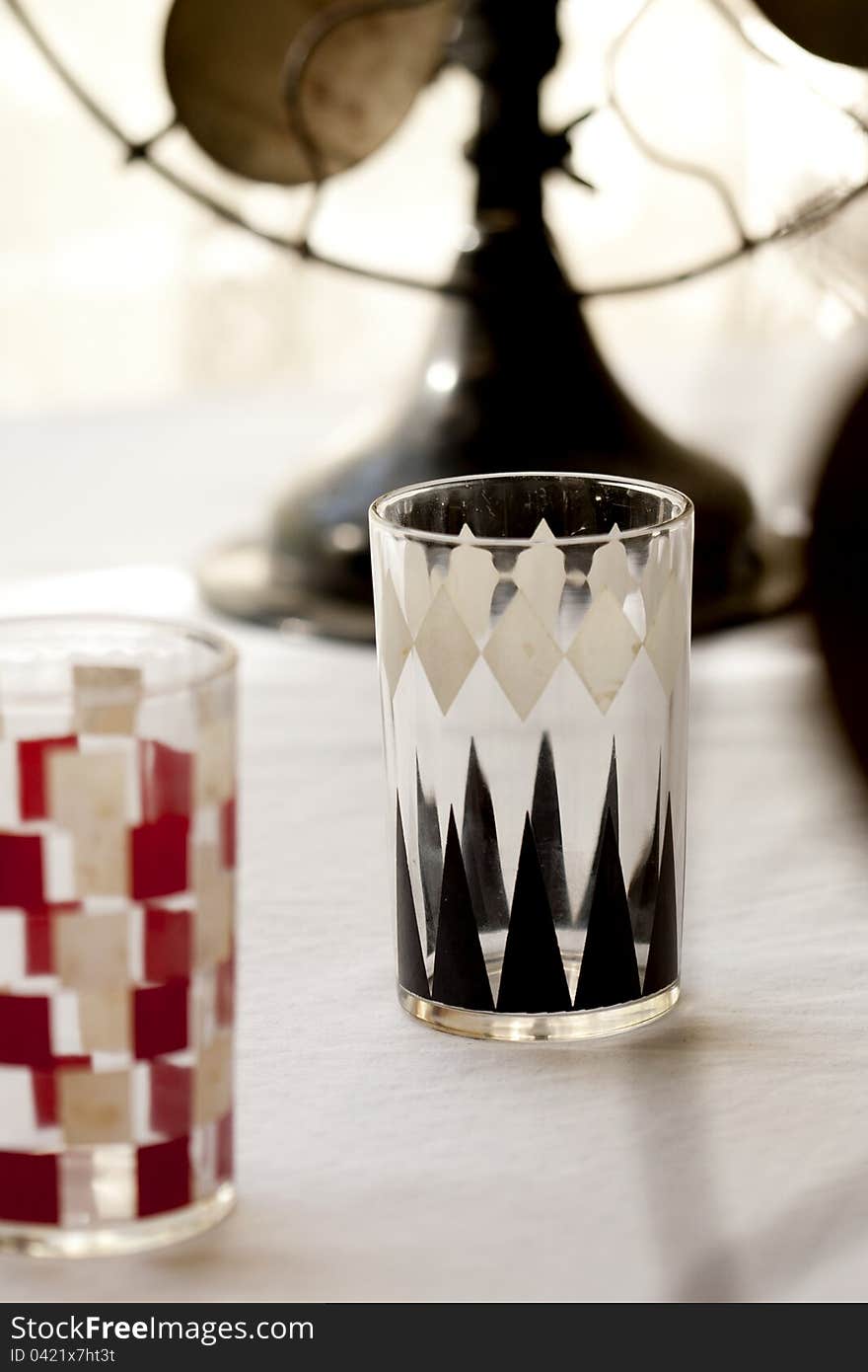 Vintage juice glasses in checkerboard and backgamm