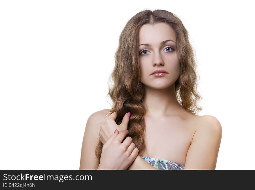 Portrait of a beautiful girl holding hands hair. Portrait of a beautiful girl holding hands hair