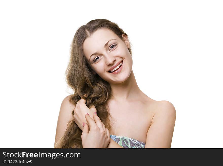 Portrait of a beautiful smiling girl holding hands hair. Portrait of a beautiful smiling girl holding hands hair