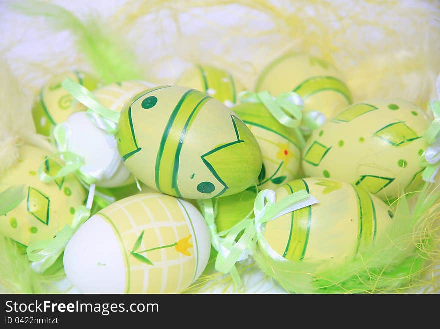 Easter eggs with green feathers. Easter eggs with green feathers