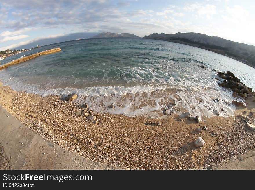 Waves sweep across the beach. Waves sweep across the beach