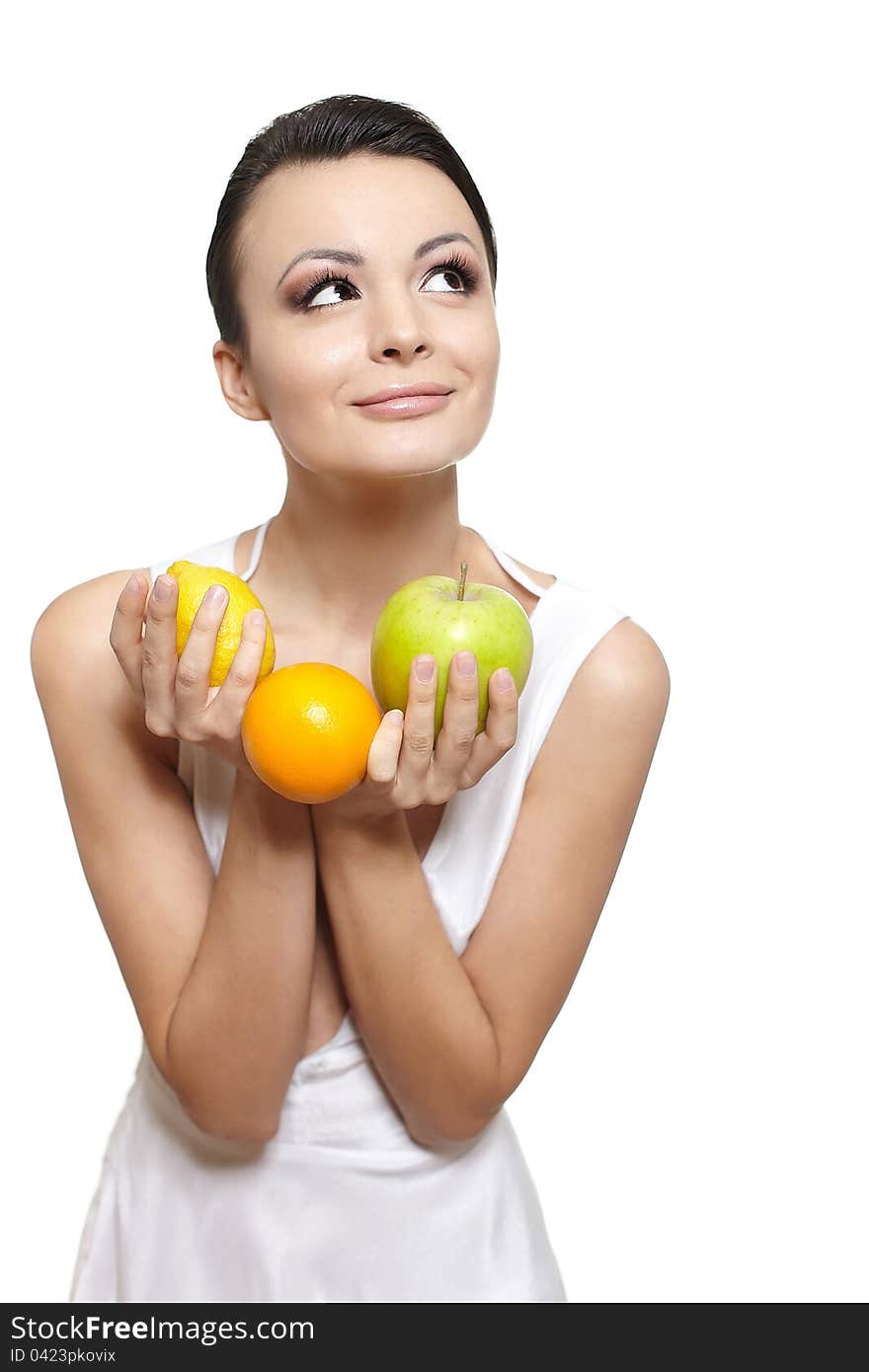 Portrait of beautiful happy smiling girl with  fruits lemon and green apple and orange isolated on white. Portrait of beautiful happy smiling girl with  fruits lemon and green apple and orange isolated on white