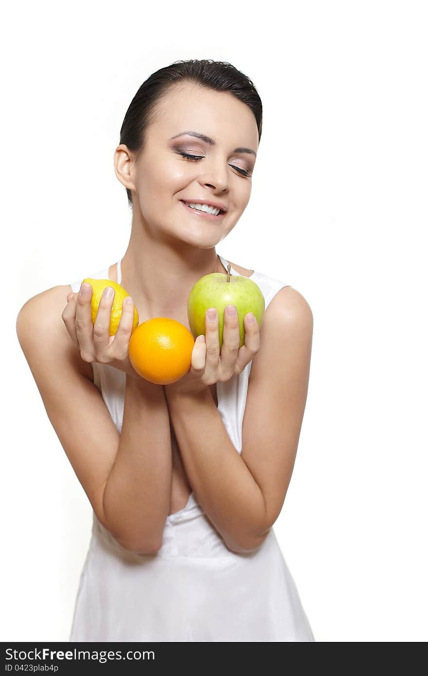 Portrait of beautiful happy smiling girl with fruits lemon and green apple and orange isolated on white. Portrait of beautiful happy smiling girl with fruits lemon and green apple and orange isolated on white