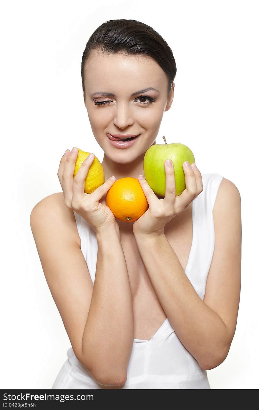 Portrait of beautiful happy smiling girl with fruits lemon and green apple and orange isolated on white. Portrait of beautiful happy smiling girl with fruits lemon and green apple and orange isolated on white