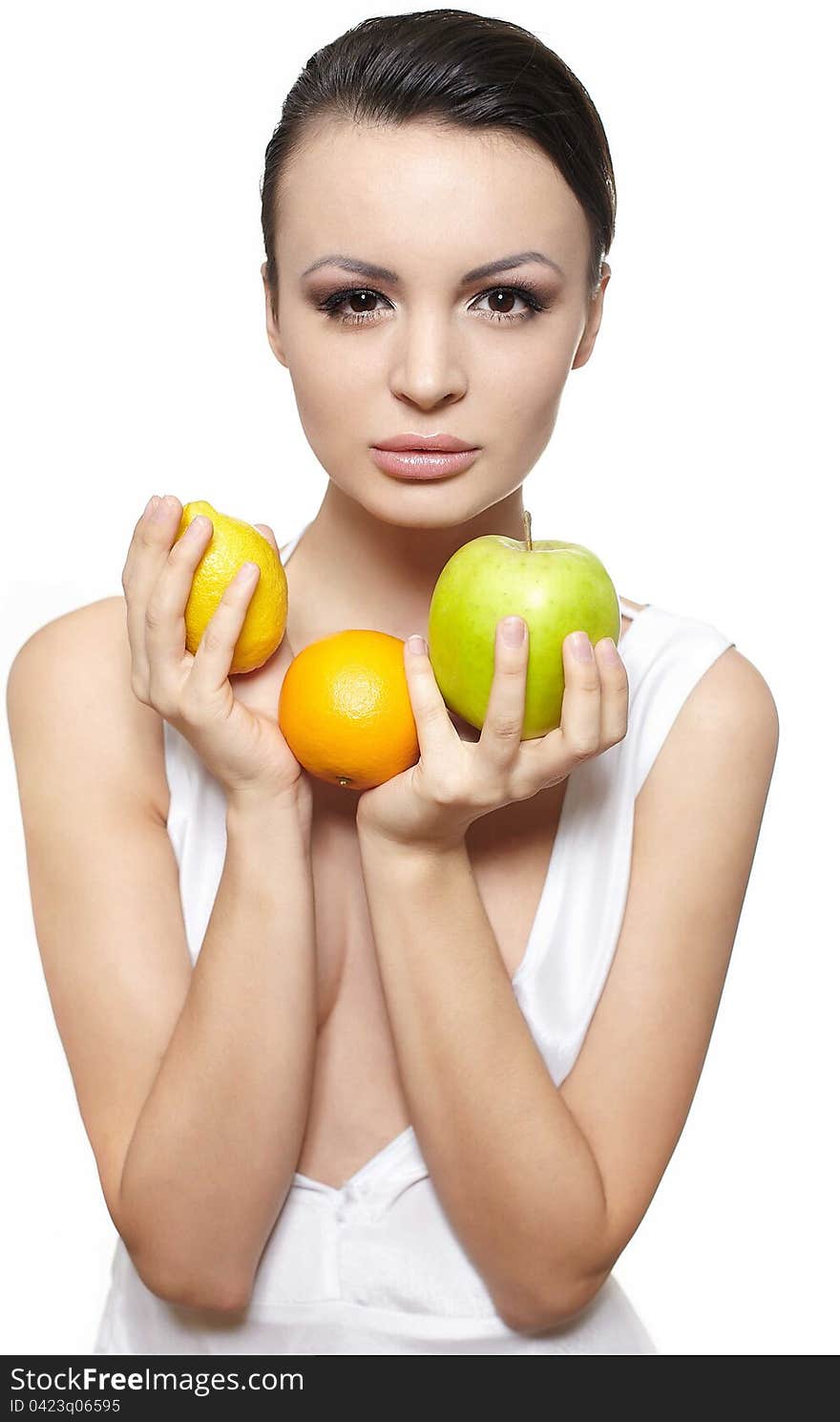 Portrait of beautiful glamour girl with  fruits lemon and green apple and orange isolated on white. Portrait of beautiful glamour girl with  fruits lemon and green apple and orange isolated on white