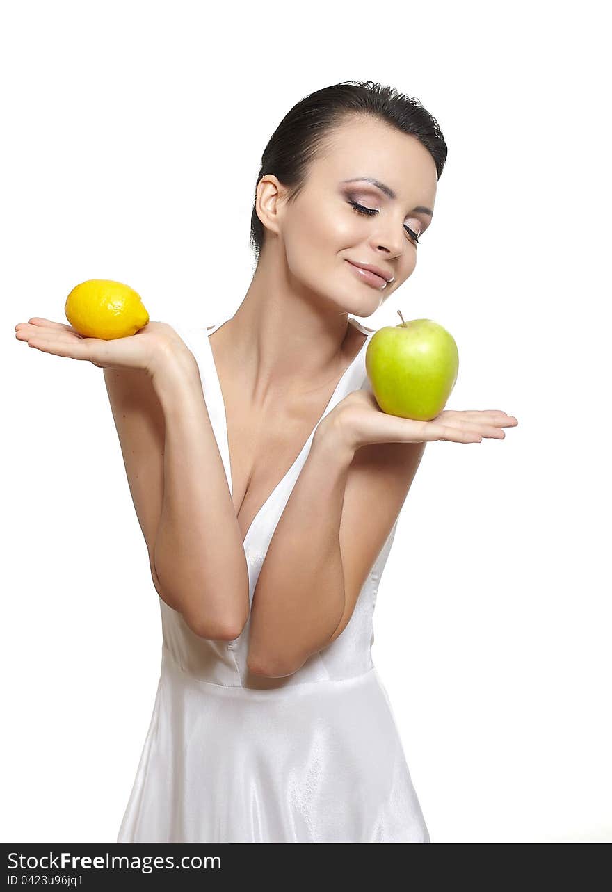 Portrait of beautiful happy smiling girl with  fruits lemon and green apple isolated on white. Portrait of beautiful happy smiling girl with  fruits lemon and green apple isolated on white