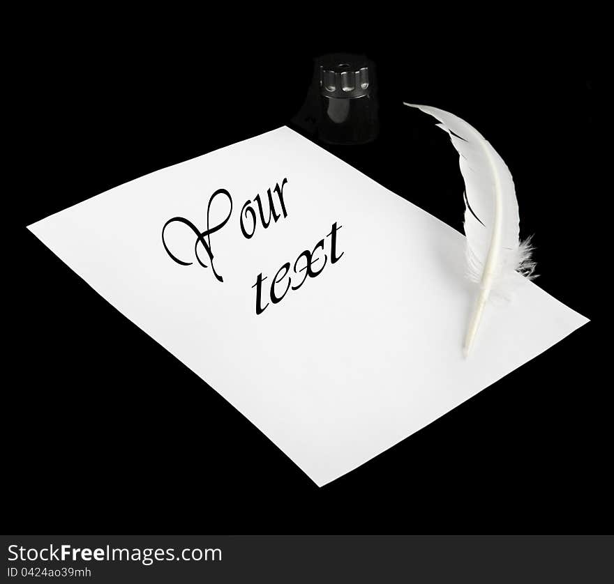 Feather, paper and inkpot on a white background